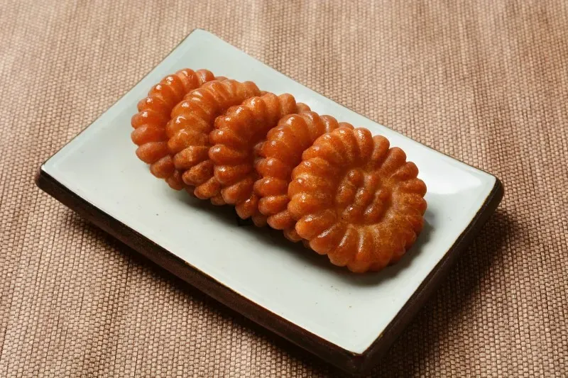 Image source: Namu Wiki Yakkwa is a traditional Korean sweet pastry, deep-fried and soaked in honey.